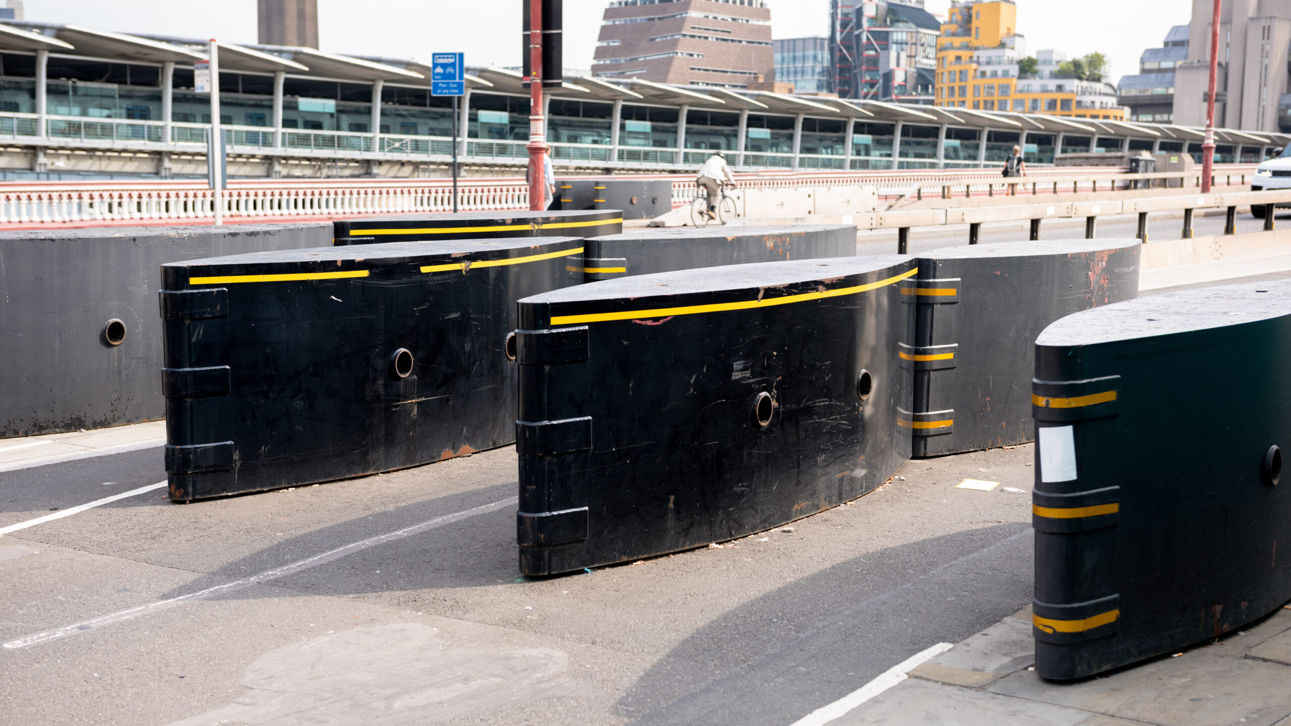 Emergency vehicle barriers placed on a main road.